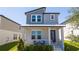 Charming two-story home featuring a covered porch and well-maintained landscaping at 4994 Citrus Leaf Blvd, Winter Garden, FL 34787