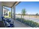 Inviting front porch with stylish railing and comfortable seating, perfect for enjoying neighborhood views at 4994 Citrus Leaf Blvd, Winter Garden, FL 34787