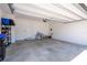 Clean two-car garage with extra room for storage, featuring a bicycle and other equipment at 4994 Citrus Leaf Blvd, Winter Garden, FL 34787