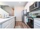 Modern kitchen with stainless steel appliances, white cabinets, and a sleek countertop, offering a stylish and functional space at 4994 Citrus Leaf Blvd, Winter Garden, FL 34787