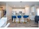 Spacious kitchen with an island, complete with modern appliances and stylish seating, perfect for entertaining at 4994 Citrus Leaf Blvd, Winter Garden, FL 34787