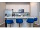 Spacious kitchen with an island, complete with modern appliances and stylish seating, perfect for entertaining at 4994 Citrus Leaf Blvd, Winter Garden, FL 34787