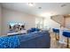 Comfortable living room with modern decor, entertainment center, and easy access to dining area at 4994 Citrus Leaf Blvd, Winter Garden, FL 34787