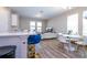 Open-concept living room boasts hardwood floors, natural light, and modern furnishings, creating a warm and inviting atmosphere at 4994 Citrus Leaf Blvd, Winter Garden, FL 34787