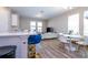 Open-concept living room boasts hardwood floors, natural light, and modern furnishings, creating a warm and inviting atmosphere at 4994 Citrus Leaf Blvd, Winter Garden, FL 34787