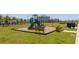Community playground with slides, climbing structures, and picnic benches at 4994 Citrus Leaf Blvd, Winter Garden, FL 34787