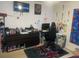 This bedroom has a large dresser, a computer desk, and is decorated with Spider-Personal decor at 5471 Vineland Rd # 7108, Orlando, FL 32811