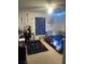 This bedroom is decorated with a bed, Spider-Personal decorations, and blue LED lights at 5471 Vineland Rd # 7108, Orlando, FL 32811