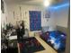 This bedroom is decorated with a bed, Spider-Personal decorations, and blue LED lights at 5471 Vineland Rd # 7108, Orlando, FL 32811