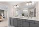 Elegant bathroom with dual sinks, quartz countertops and gray shaker cabinets at 5610 Wood Bridge Pl, St Cloud, FL 34771