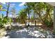 Enjoy pond views from the back patio shaded by trees at 6114 Peregrine Ave # D03, Orlando, FL 32819