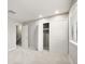 A bright bedroom featuring neutral paint, plush carpeting, and ample closet space at 6114 Peregrine Ave # D03, Orlando, FL 32819