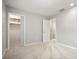 A comfortable bedroom features neutral paint, plush carpeting, and dual closets at 6114 Peregrine Ave # D03, Orlando, FL 32819