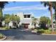 Community clubhouse features a modern design, well-maintained landscaping, and ample parking at 6114 Peregrine Ave # D03, Orlando, FL 32819