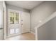 Bright foyer with neutral tones, tile flooring, and natural light streaming through the window at 6114 Peregrine Ave # D03, Orlando, FL 32819