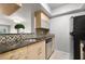 Updated kitchen features stainless steel appliances and stone countertops at 6114 Peregrine Ave # D03, Orlando, FL 32819