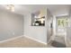 An open-concept living space features tile floors, fresh paint, and easy access to the kitchen at 6114 Peregrine Ave # D03, Orlando, FL 32819