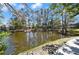 A scenic pond view surrounded by mature trees provides a relaxing atmosphere to this community at 6114 Peregrine Ave # D03, Orlando, FL 32819