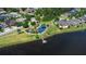 Aerial view showcasing a lakeside park with a playground and walking paths among homes at 7299 Vista Park Blvd, Orlando, FL 32829
