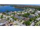 Panoramic aerial view of a residential neighborhood with a picturesque lake at 7299 Vista Park Blvd, Orlando, FL 32829