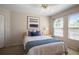 Cozy bedroom with natural light, a comfortable bed, and stylish decor at 7299 Vista Park Blvd, Orlando, FL 32829