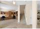 Welcoming foyer features staircase and offers views of an office area with built-in desks and shelves at 7299 Vista Park Blvd, Orlando, FL 32829