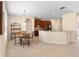 The kitchen has stainless appliances and is connected to a dining area, making this a great gathering space at 7299 Vista Park Blvd, Orlando, FL 32829
