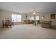 Spacious living room with neutral decor, large windows, and comfortable seating area at 7299 Vista Park Blvd, Orlando, FL 32829