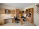 Comfortable office area with custom wood cabinets and lots of natural light at 7299 Vista Park Blvd, Orlando, FL 32829