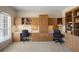 Well-lit office space with custom built-in shelving and plenty of desk space at 7299 Vista Park Blvd, Orlando, FL 32829