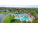 Aerial view of resort-style pool and community amenities near the lake, perfect for relaxation and recreation at 7299 Vista Park Blvd, Orlando, FL 32829