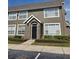 Charming two-story condo with a gable-roof entryway and well-maintained landscaping at 9141 Lee Vista Blvd # 308, Orlando, FL 32829