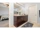Serene blue-toned bathroom with double sink, vanity, great lighting, and lots of counter space at 9731 Pepper Tree Trl, Wildwood, FL 34785