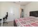 Comfortable bedroom offering a bed, closet, desk, and chair is ideal for relaxation and study at 9731 Pepper Tree Trl, Wildwood, FL 34785