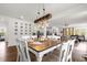 Elegant dining area open to the living room and kitchen, features stylish seating and modern decor at 1025 Augustus Dr, Davenport, FL 33896