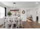 Bright dining room showcasing a rustic chandelier, large mirror, and ample seating for entertaining at 1025 Augustus Dr, Davenport, FL 33896