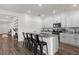 Modern kitchen featuring granite countertops, a center island with seating, and sleek cabinetry at 1025 Augustus Dr, Davenport, FL 33896