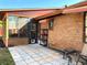 Backyard with tiled patio, black door, and sunroom addition at 1062 Stillwater Ave, Deltona, FL 32725