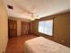 Bedroom with a ceiling fan, wood floor and a double-door closet at 1062 Stillwater Ave, Deltona, FL 32725