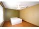 Bedroom with window, ceiling fan, and a twin bed at 1062 Stillwater Ave, Deltona, FL 32725