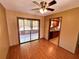 Dining area adjacent to kitchen with slider to the back and hardwood floors at 1062 Stillwater Ave, Deltona, FL 32725