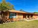 Beautiful brick home showcasing a neatly landscaped front yard and installed solar panels at 1062 Stillwater Ave, Deltona, FL 32725