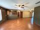 Expansive living room featuring hardwood floors and archways to other rooms at 1062 Stillwater Ave, Deltona, FL 32725