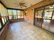 Enclosed sunroom offering tile floors, and many windows at 1062 Stillwater Ave, Deltona, FL 32725