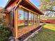 The sunroom shows multiple windows that let in ample natural light at 1062 Stillwater Ave, Deltona, FL 32725