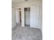 Well-lit bedroom with gray carpet, featuring a closet and ensuite bathroom at 11151 Rising Sun St, Orlando, FL 32829