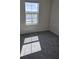 Cozy bedroom with plush carpeting and a window offering scenic views at 11151 Rising Sun St, Orlando, FL 32829