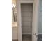 Bedroom closet with tiled floor, wire shelving, and convenient access to bathroom at 11151 Rising Sun St, Orlando, FL 32829