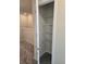 Linen closet featuring multiple wire shelves, providing ample storage space in a carpeted room at 11151 Rising Sun St, Orlando, FL 32829