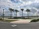 Entrance to The Parks featuring palm trees, fountains, and lush landscaping at 11151 Rising Sun St, Orlando, FL 32829